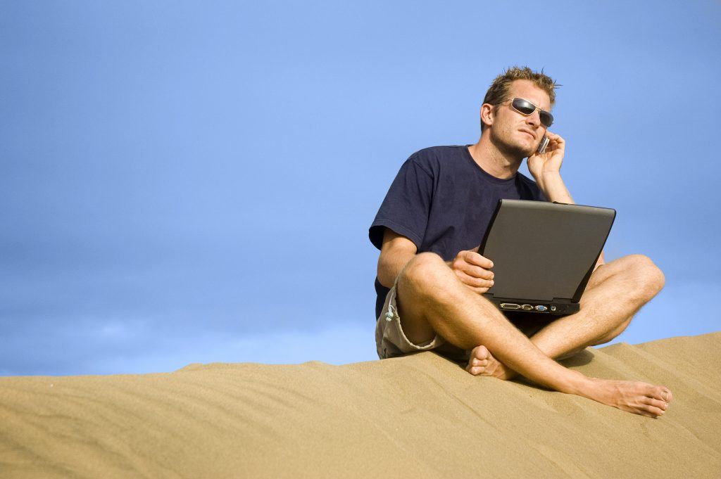 bigstock Working On The Beach 921861