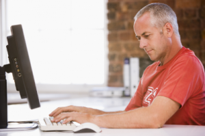 middle aged guy on computer