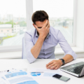 stressed trader on laptop 1