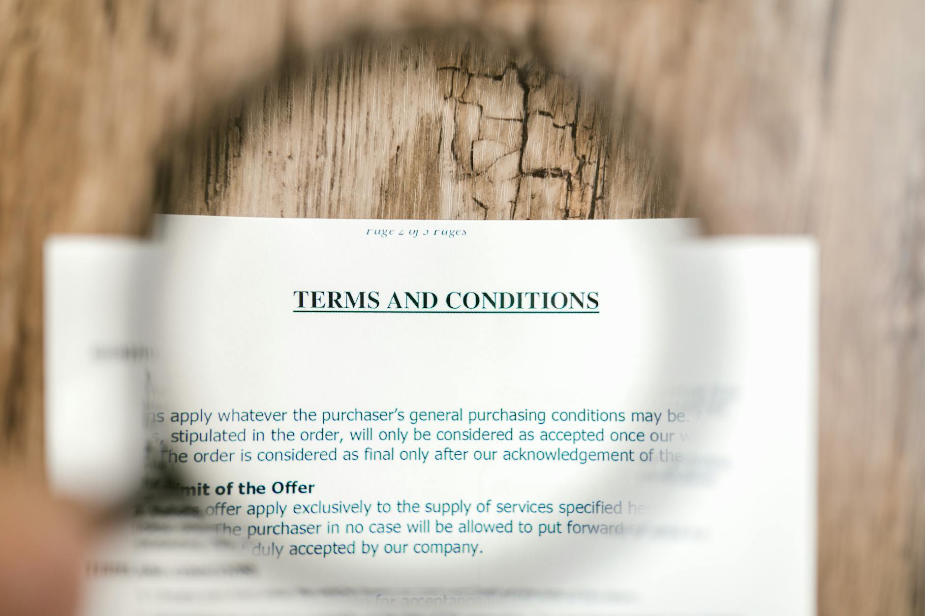 How to Spot a Forex Coaching Scam: 9 Warning Signs 6 magnifying glass over terms and conditions document highlighting refund clause